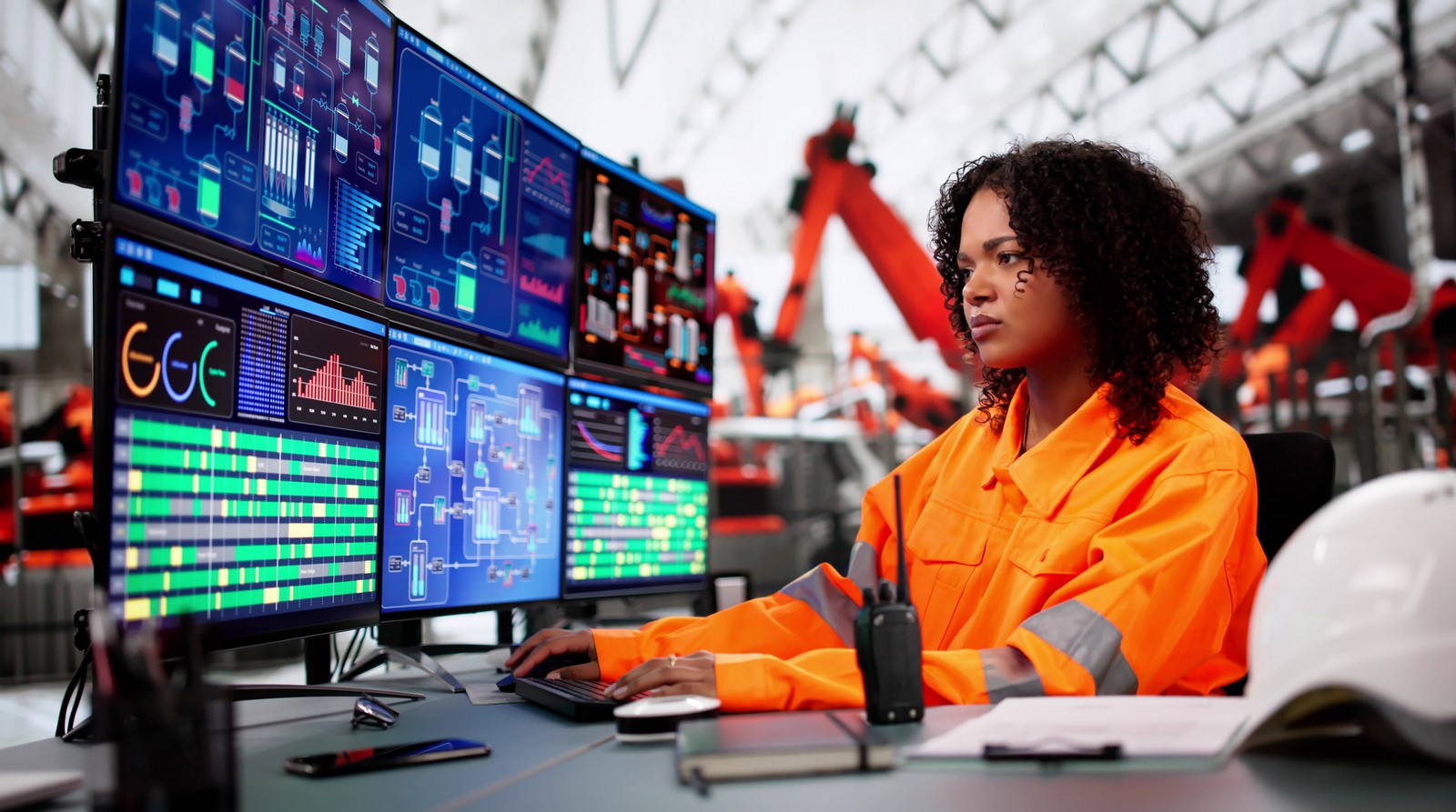 Engineer monitoring SCADA control systems in a control room